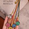 Himalayan Guardian: Hand-Painted Miniature Thangka of Five Wealth Deities Car Charm